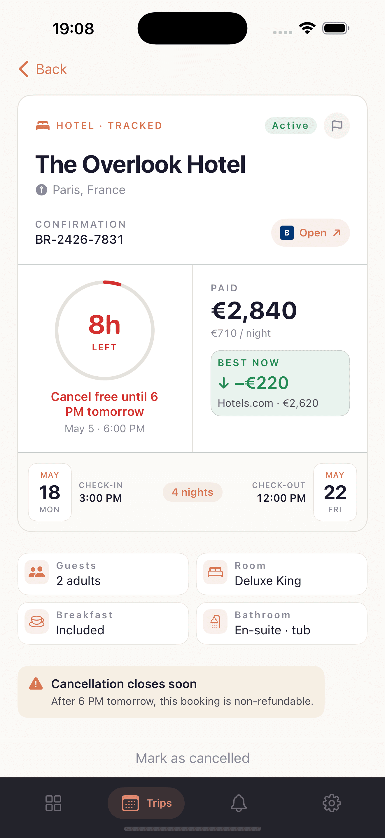 iOS booking detail for The Overlook Hotel, Paris, France. A ring counter shows '8h LEFT' in red, with the caption 'Cancel free until 6 PM tomorrow, May 5 6 PM'. The paid amount is €2,840 (€710/night). A 'Best Now' chip shows -€220, Hotels.com €2,620. Check-in May 18 Monday, check-out May 22 Friday, 4 nights. Guests 2 adults, room Deluxe King, breakfast included, en-suite tub. Footer warning: cancellation closes soon, after 6 PM tomorrow this booking is non-refundable.